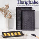 Floral swirl texture baking sheet set with three rimmed pans designed for even heating and easy release